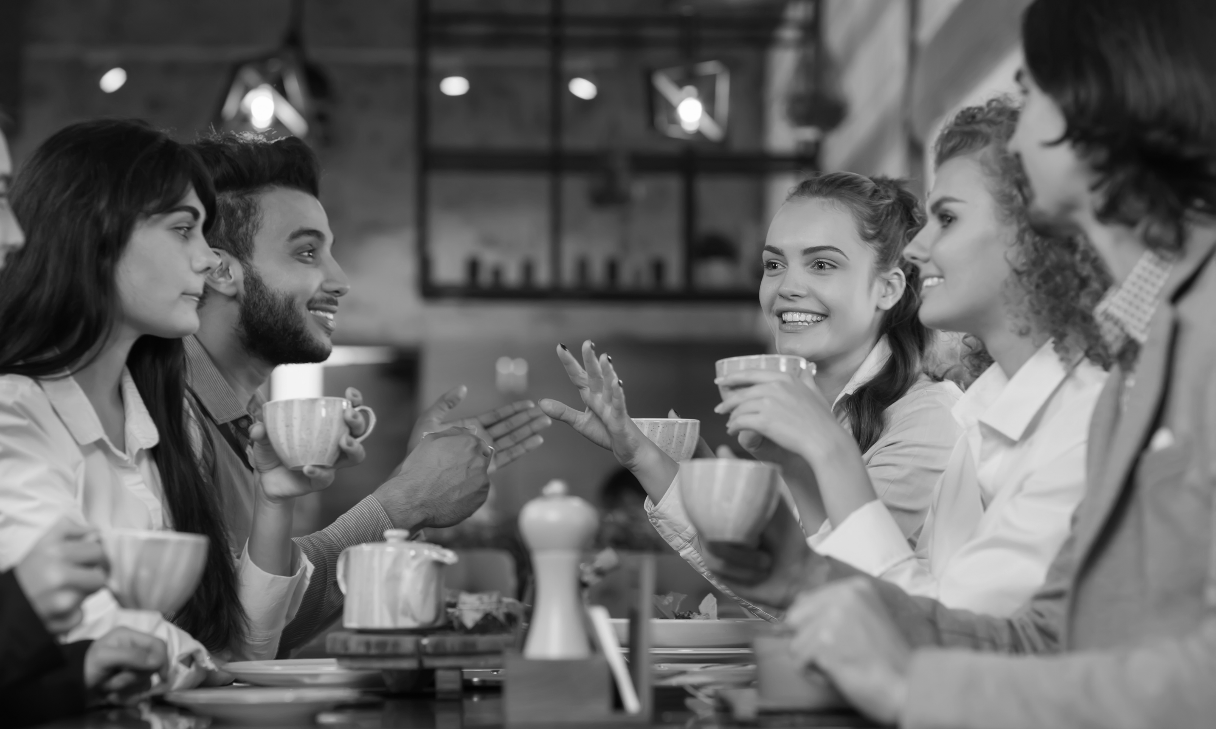 Group of people drinking coffee together